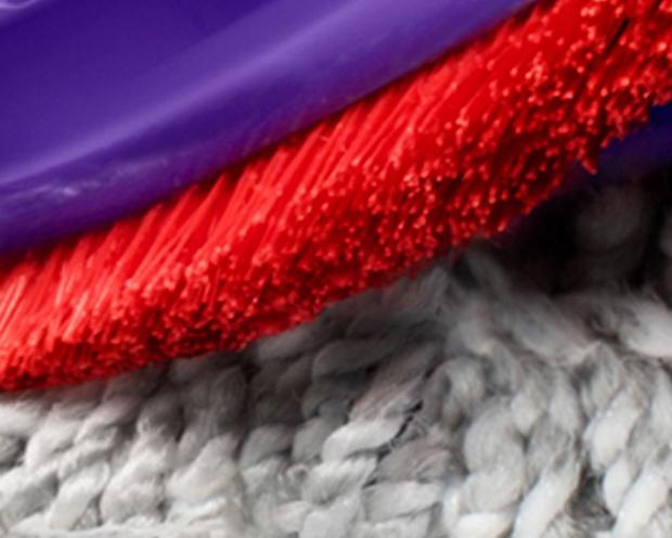 The Dyson Digital Motorbar head deep cleaning carpet.