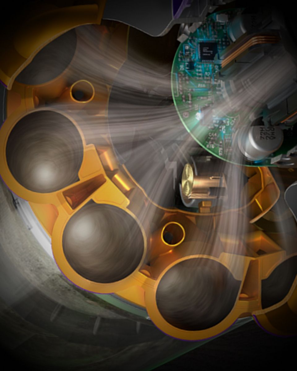 Corte transversal que muestra la tecnología ciclónica dentro de la aspiradora Dyson V15 Detect. Corte transversal que muestra la tecnología ciclónica dentro de la aspiradora Dyson V15 Detect.