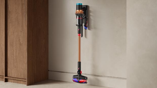 Dyson V16 Piston Animal vacuum stored with tools on the wall mounted dock.