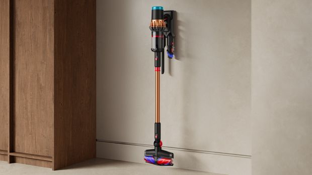 Dyson V16 Piston Animal vacuum stored with tools on the wall mounted dock.