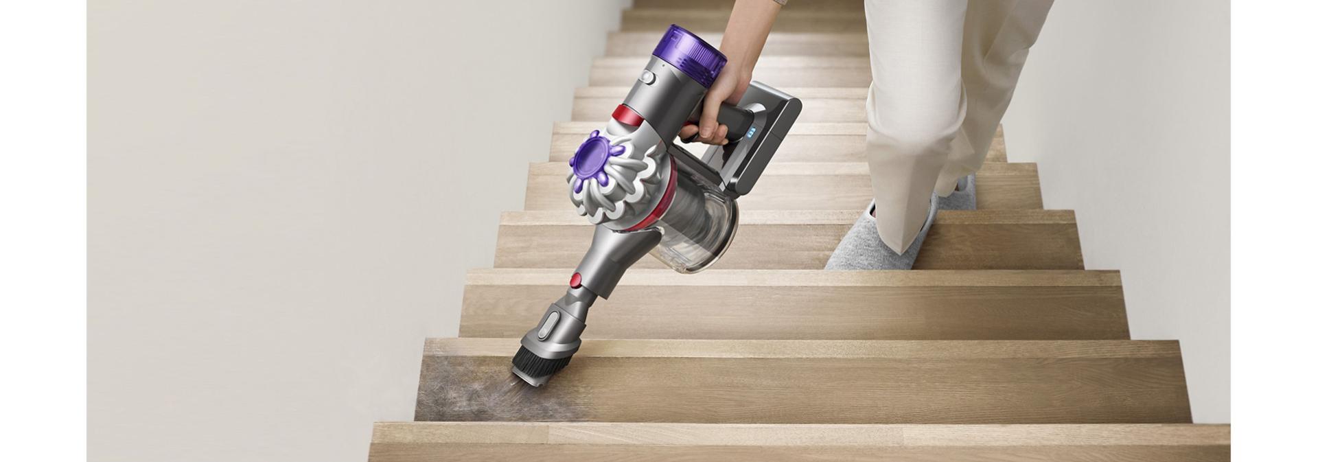 Dyson V8 Focus Clean handheld vacuum used to clean stairs.