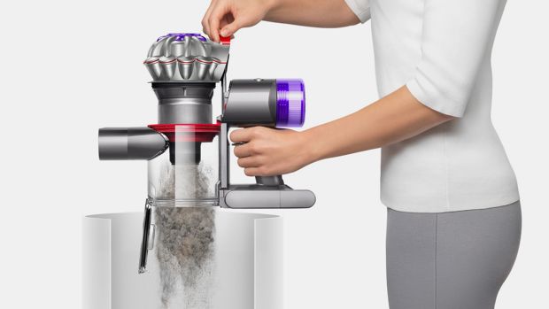 Dyson V8 Focus Clean handheld vacuum emptied into a bin.