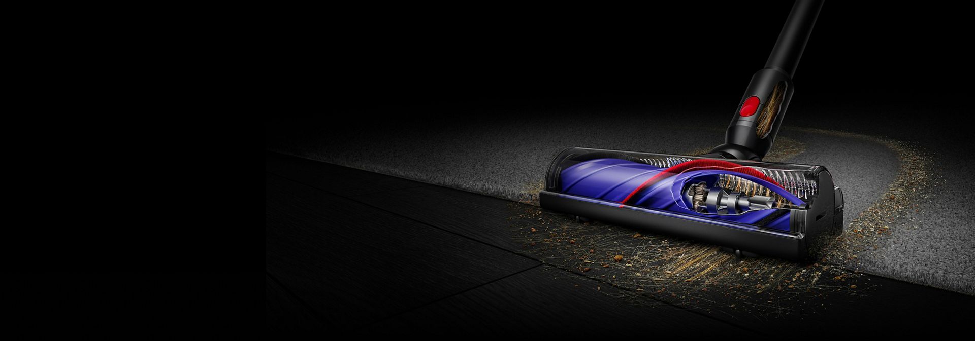 Dyson Motorbar cleaner head used to clean dust and debris from a hard floor.