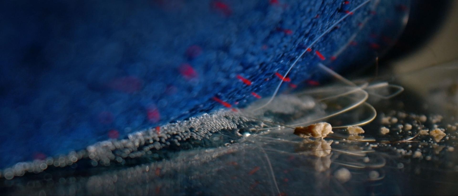 A close-up of the Dyson Clean+Wash Hygiene hard floor cleaner removing hair from the floor.