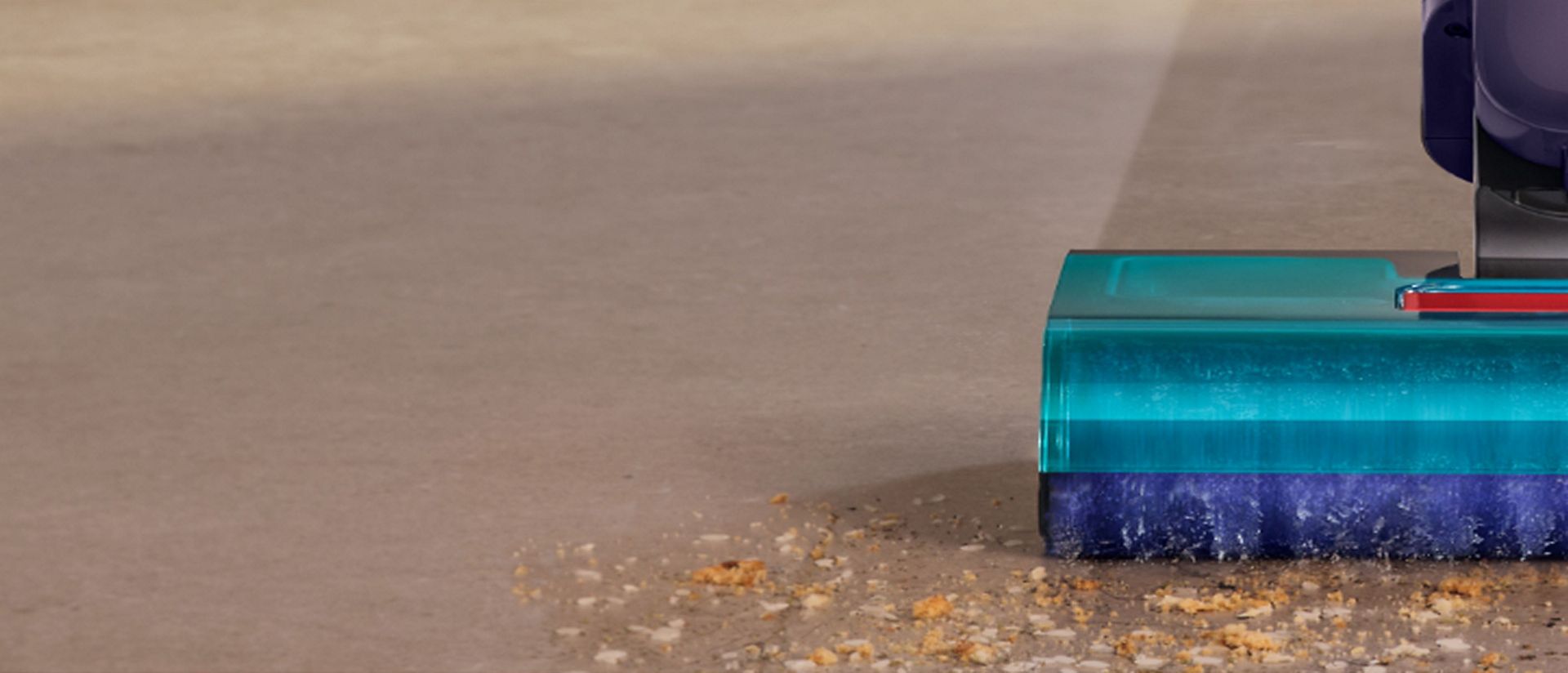 The Dyson Clean+Wash Hygiene hard floor cleaner cleaning dry debris from the floor.