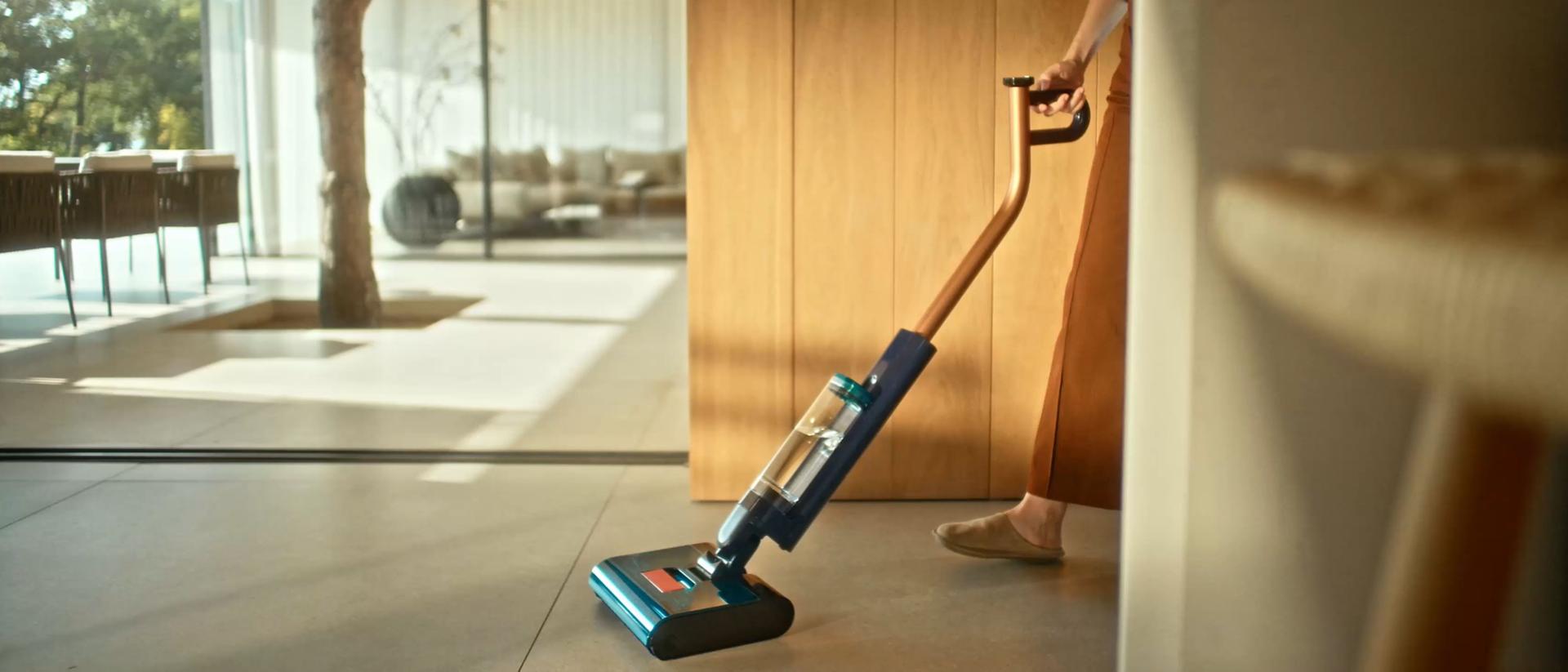 The Dyson Clean+Wash Hygiene hard floor cleaner washing a floor.