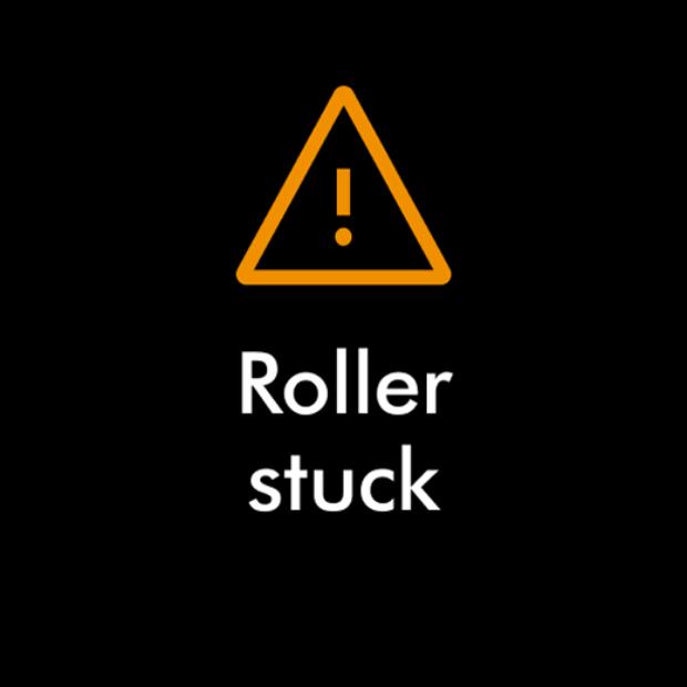 Výstražná ikona s textem: Zaseknutý rotační kartáč.