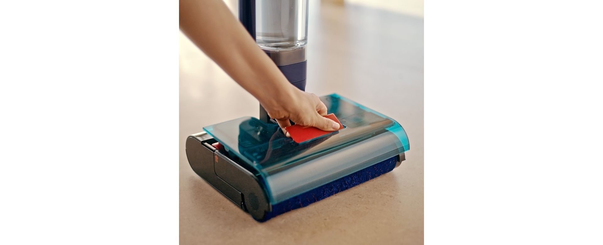The unit is removed from the head of the Dyson Clean+Wash Hygiene hard floor cleaner.
