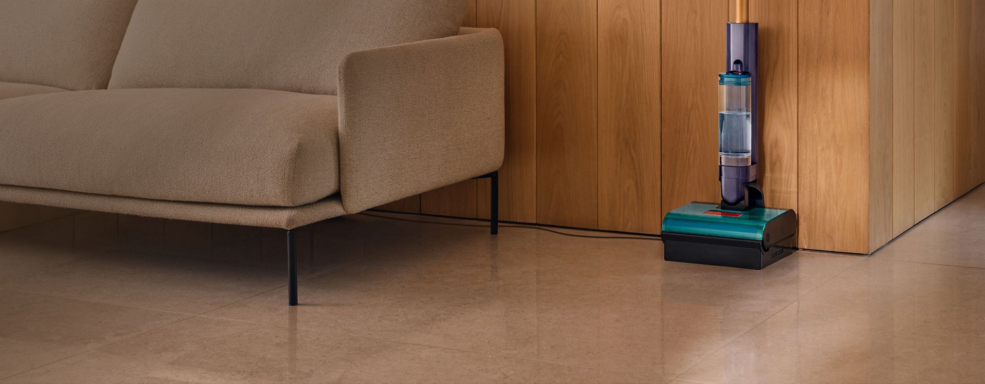 A docked Dyson Clean+Wash Hygiene hard floor cleaner.