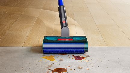 Dyson W1 PencilWash cleaner cleaning between hard floor types. Dyson W1 PencilWash cleaner cleaning between hard floor types.