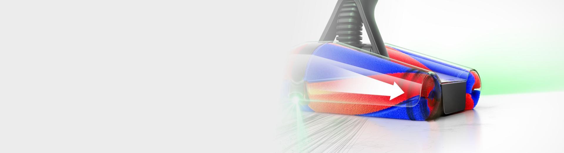 Detailní pohled na podlahovou hubici Dyson Fluffycones zobrazující osvětlení a směr, kterým se pohybují nasáté vlasy.