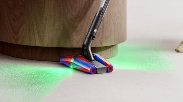 Dyson Fluffycones cleaner head used to clean right up to the edge of a cabinet.
