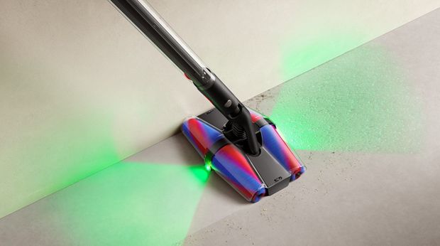 Dyson Fluffycones cleaner head used to highlight hidden dust with illumination.