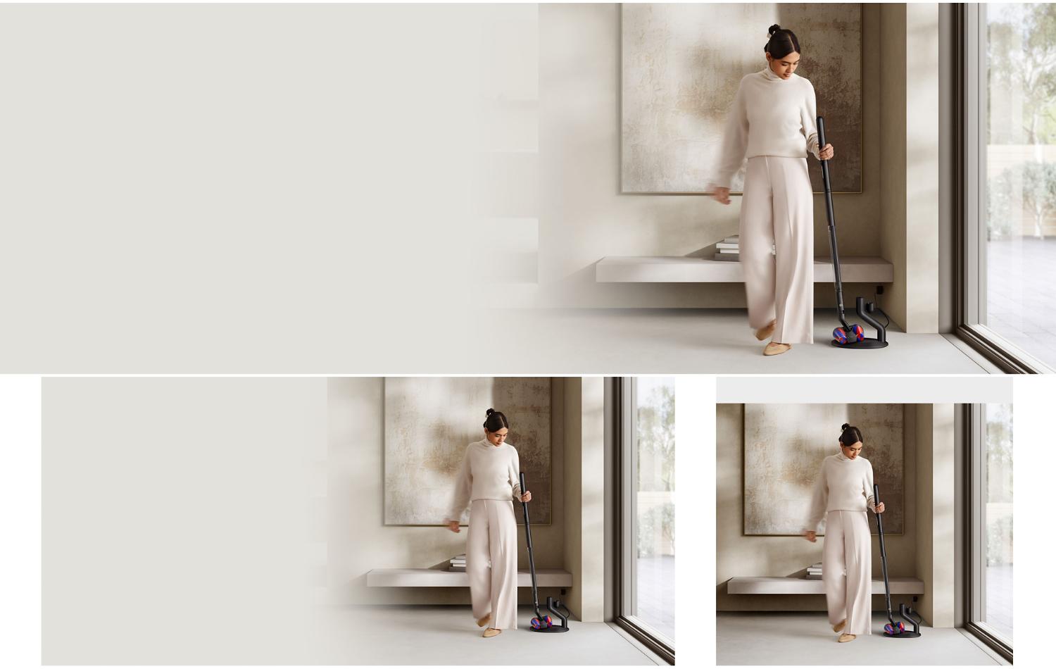 A woman grabs her Dyson PencilVac cleaner from its charging dock.