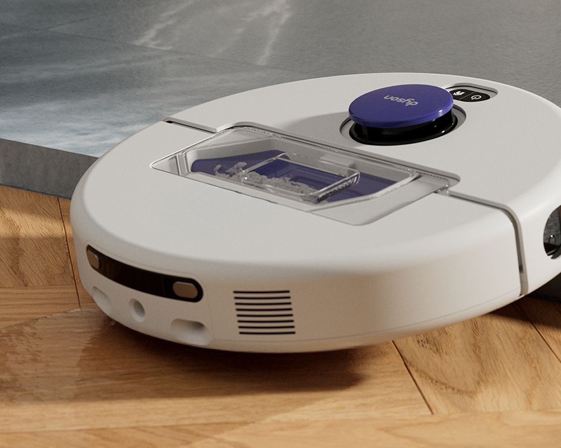 A Dyson R1 Nurovi or R2 Nurovi robot vacuum cleaner climbing a small step. A Dyson R1 Nurovi or R2 Nurovi robot vacuum cleaner climbing a small step.