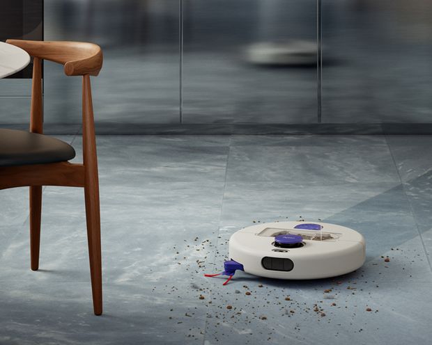 A Dyson R1 Nurovi or R2 Nurovi robot vacuum cleaner cleaning a hard floor.