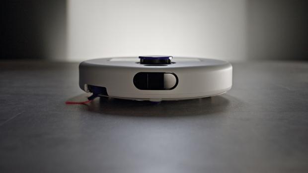 Dyson R2 Nurovi Wash+Dry robot vacuum cleaning a hard floor.