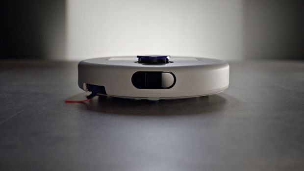 Dyson R2 Nurovi Wash+Dry robot vacuum cleaning a hard floor.