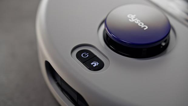 Power and home buttons on the Dyson R2 Nurovi Wash+Dry robot vacuum.