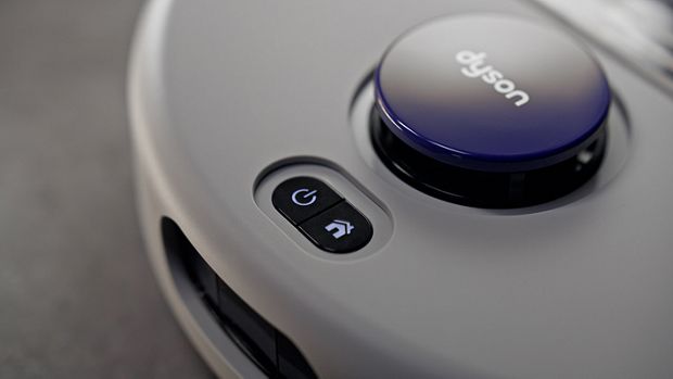 Power and home buttons on the Dyson R2 Nurovi Wash+Dry robot vacuum.
