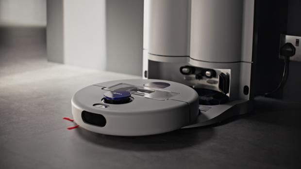 Dyson R2 Nurovi Wash+Dry robot vacuum emerging from its dock.