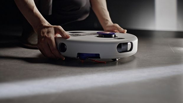 Dyson R2 Nurovi Wash+Dry robot vacuum placed on a floor.