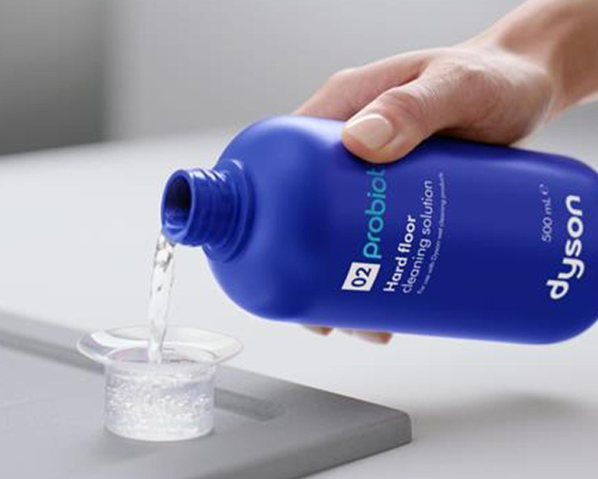 Dyson 01 Hard floor cleaning solution is decanted into a measuring cup.