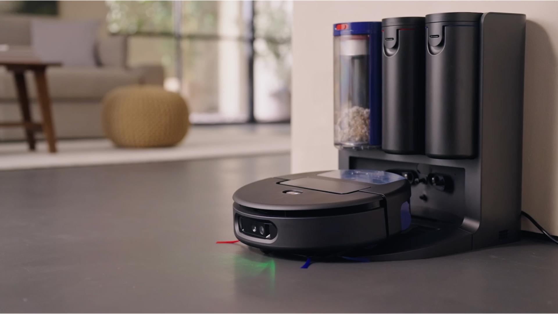 The Dyson Spot+Scrub Ai robot vacuum returns to its docking station.