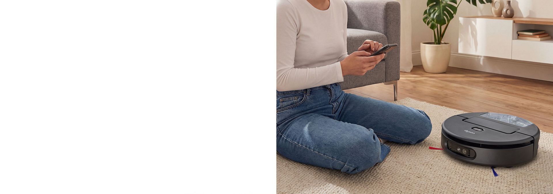The owner of a Dyson Spot+Scrub Ai robot vacuum uses their phone to book the Dyson Concierge service.