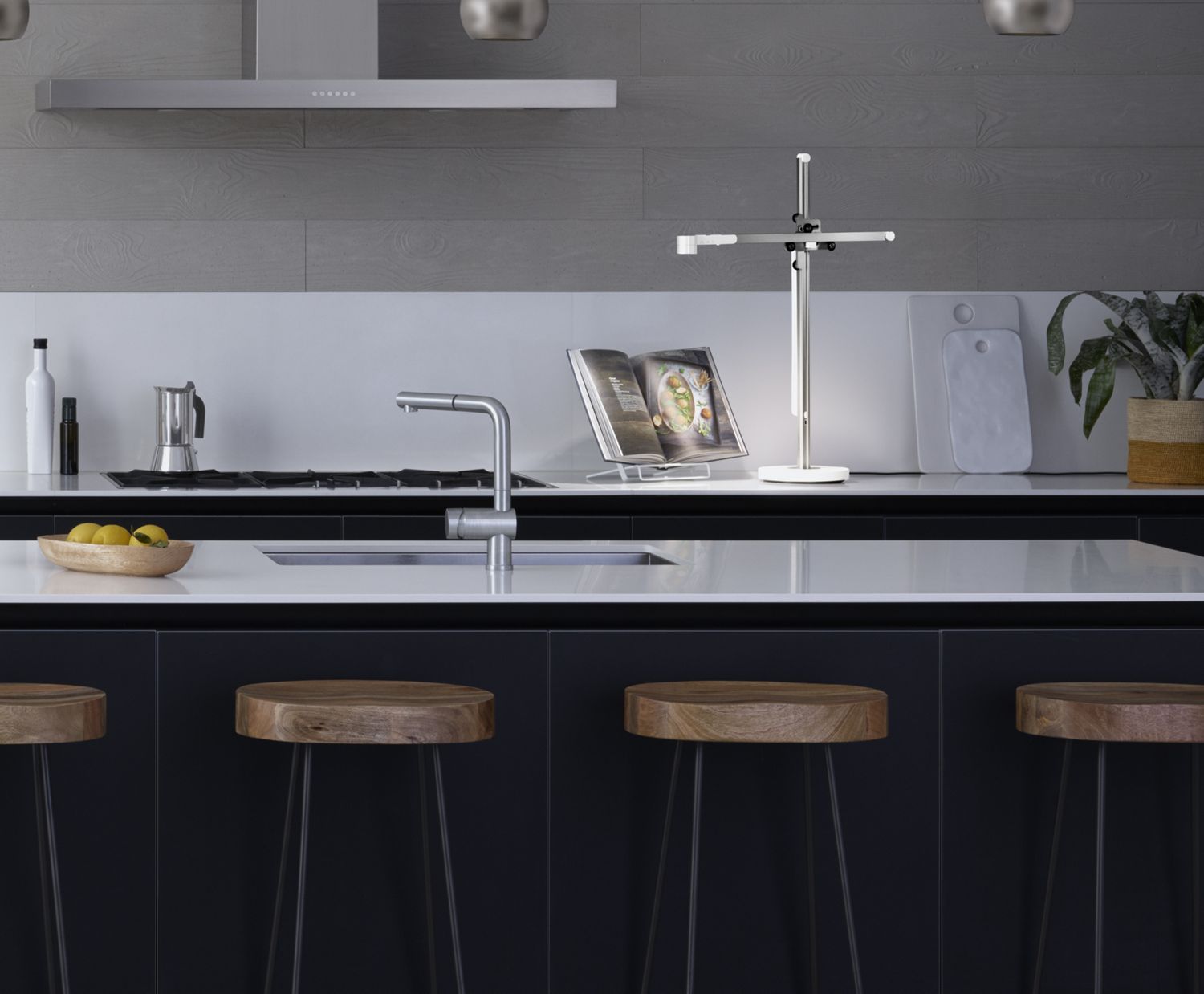 Dyson Lightcycle task light illuminating a recipe book in the kitchen