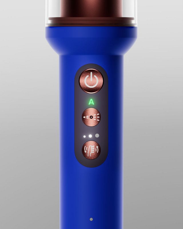 The buttons on the Dyson CameraJet toothbrush handle.