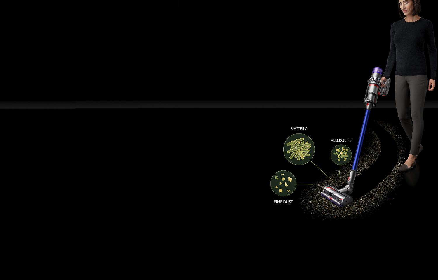 A Dyson V11™ vacuum picking up fine dust, allergens and pollen from the floor.