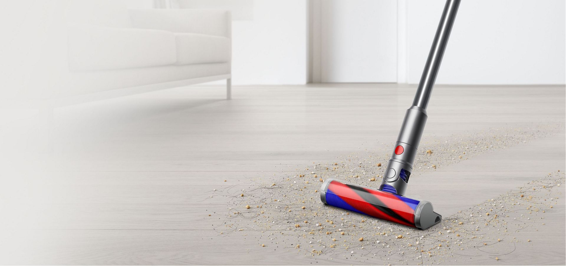 Dyson Micro 1.5kg cleaning debris from hard floor.