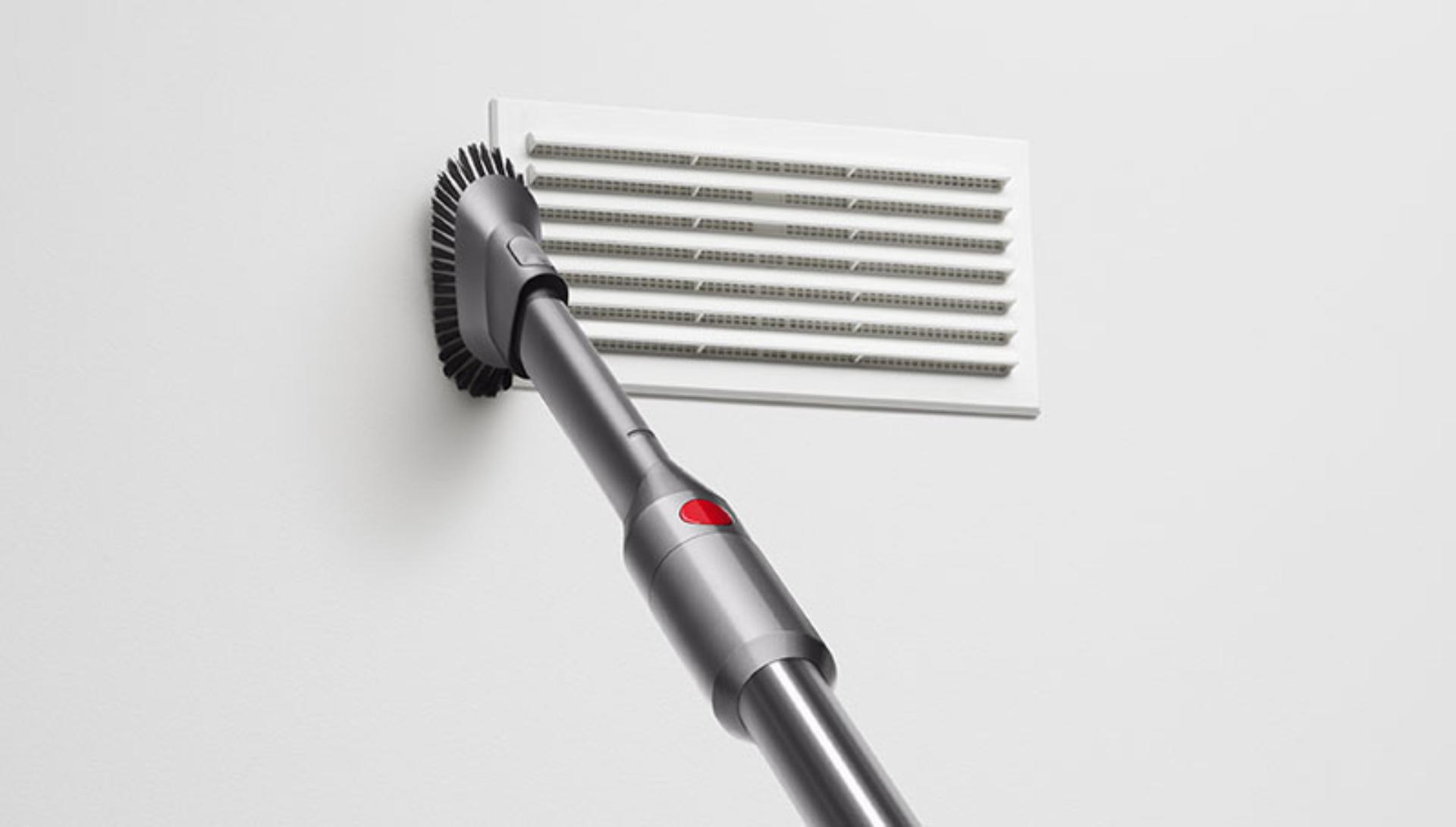 Dyson Micro 1.5kg vacuum cleaning a wall