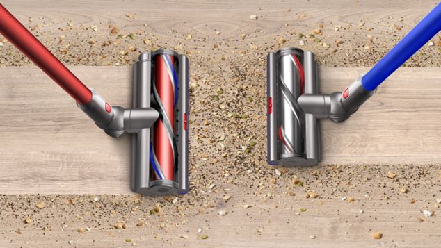 Two Dyson Outsize vacuum cleaning the floor