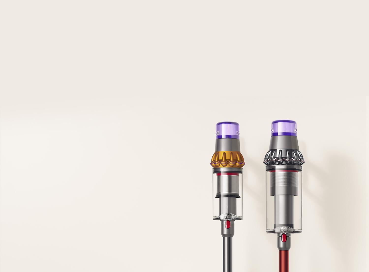 Dyson Outsize vacuum with 150% bigger bin next to a Dyson V11 Absolute vacuum bin.