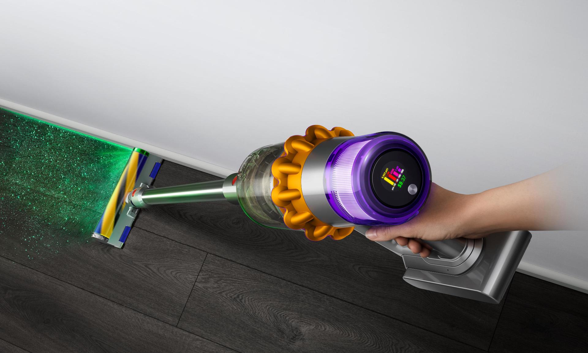 Close-up of hand holding the Dyson V15 Detect vacuum