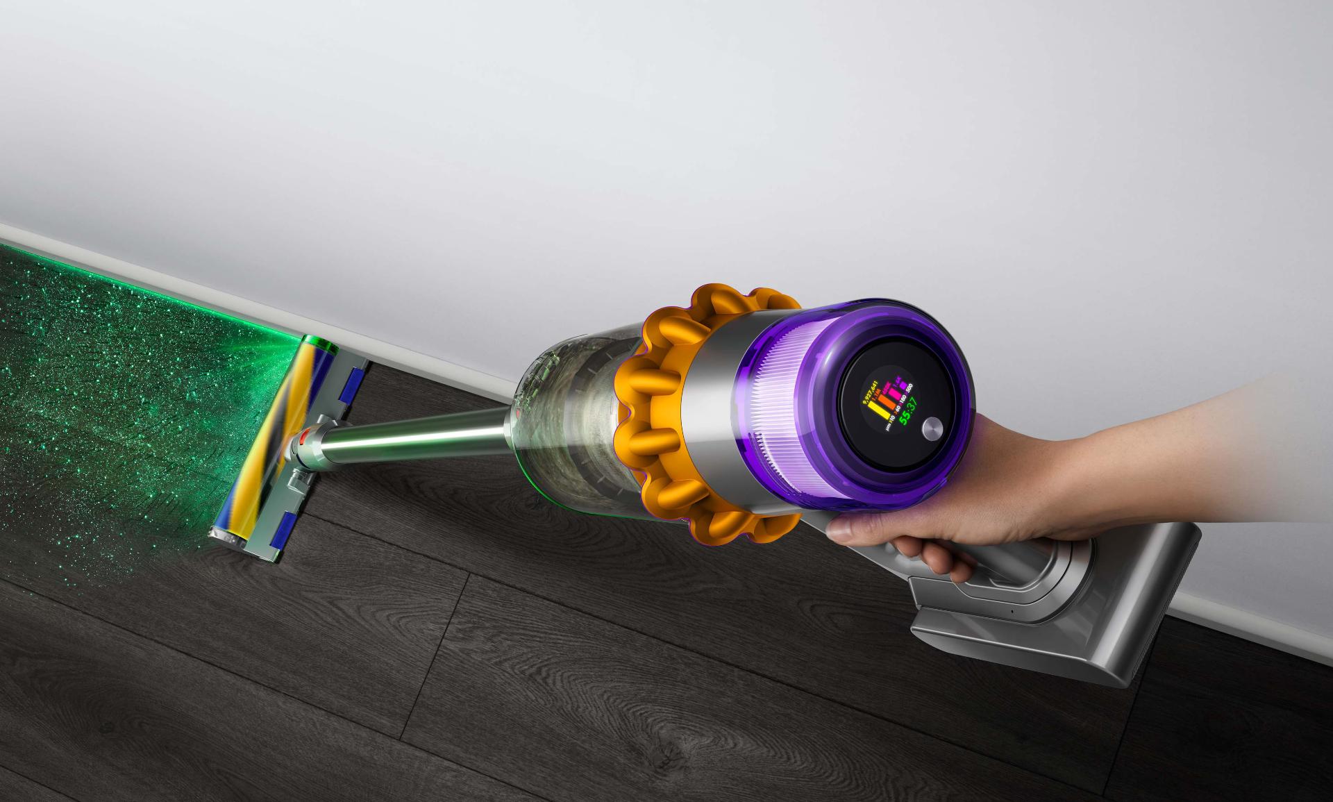 Close-up of hand holding the Dyson V15 Detect vacuum