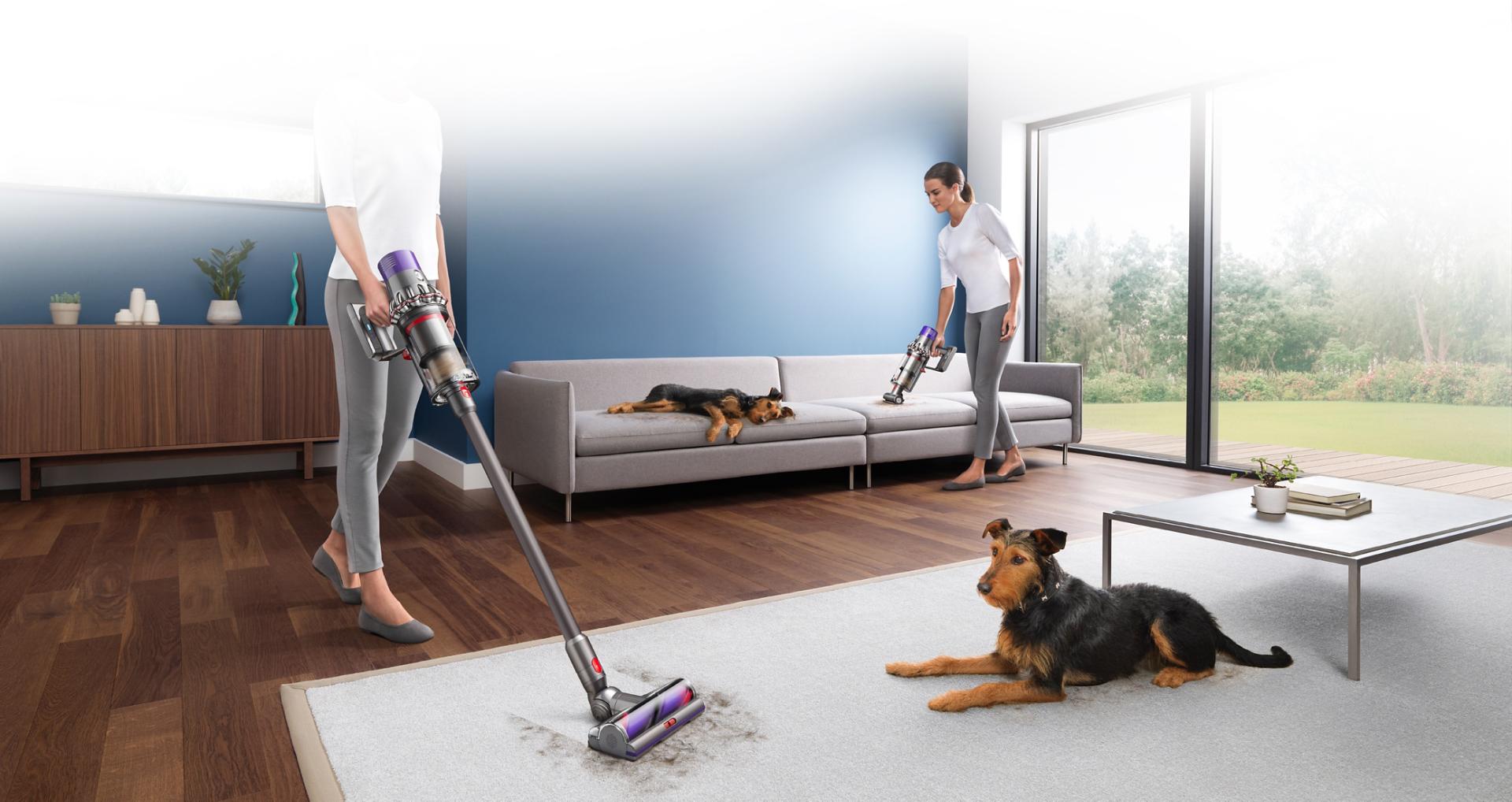 Women vacuuming after dog
