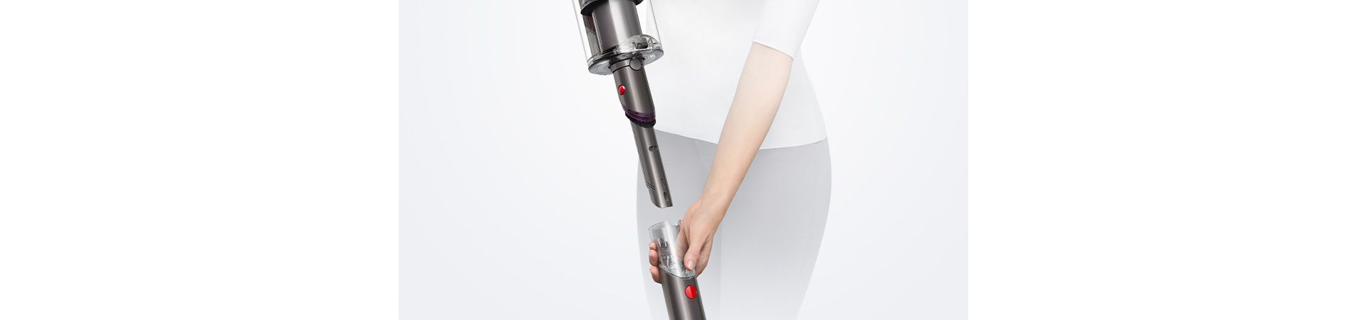 Woman revealing the built-in dusting and crevice tool