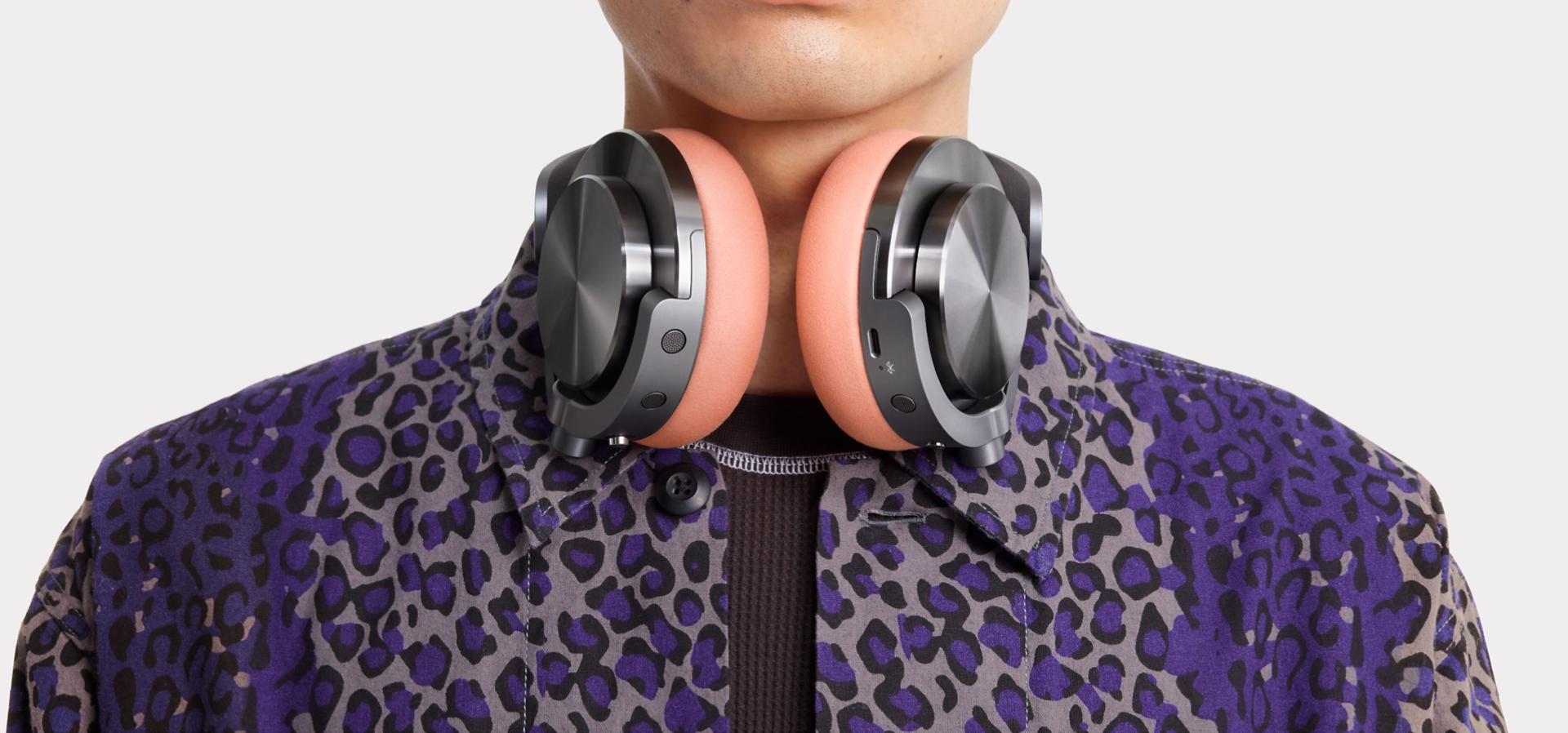 Model with the Dyson OnTrac headphones around their neck.