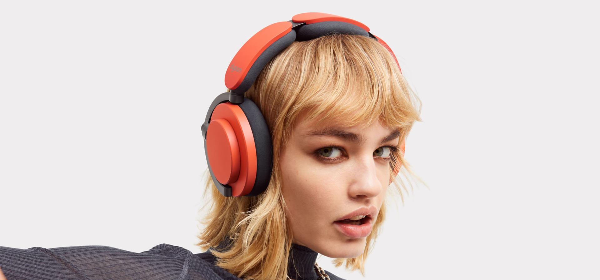 Model wearing Dyson OnTrac headphones while looking at the camera.