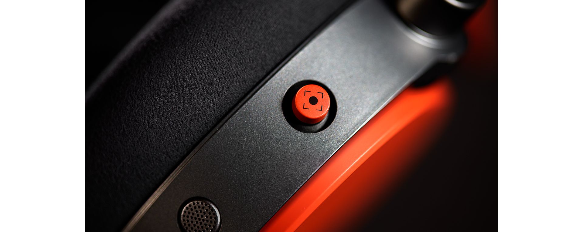 An extreme close up of the intuitive joystick on the Dyson OnTrac headphones.