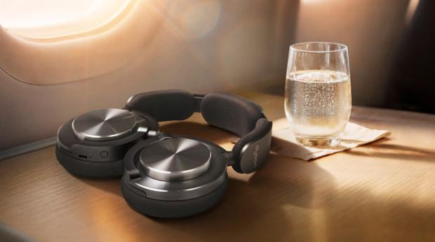 Dyson OnTrac headphones folded flat to lie conveniently on a table.