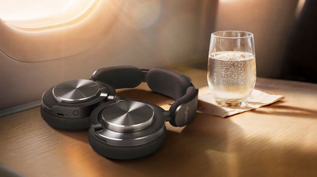 Dyson OnTrac headphones folded flat to lie conveniently on a table.