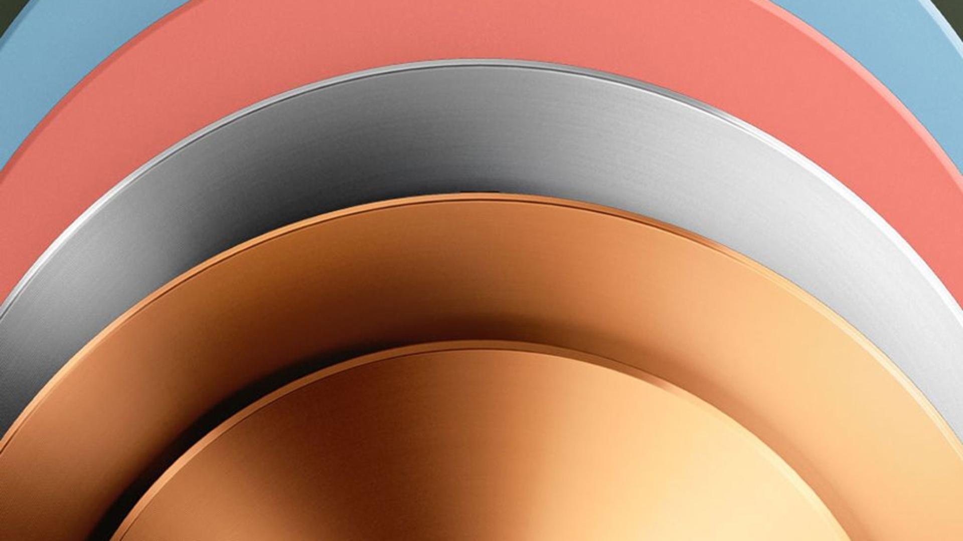 A stack of Dyson OnTrac outer caps in various colours.