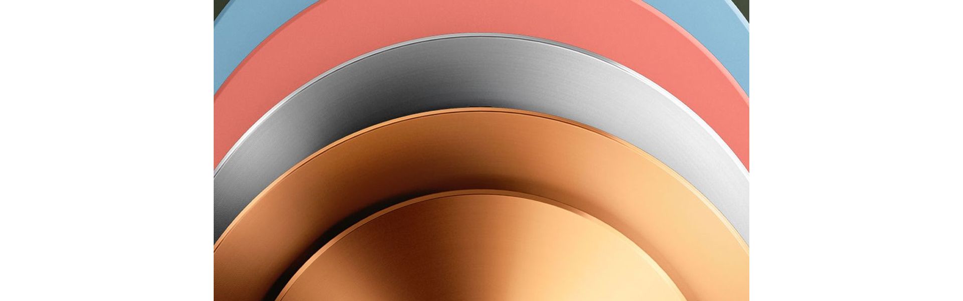 A stack of Dyson OnTrac outer caps in various colours.