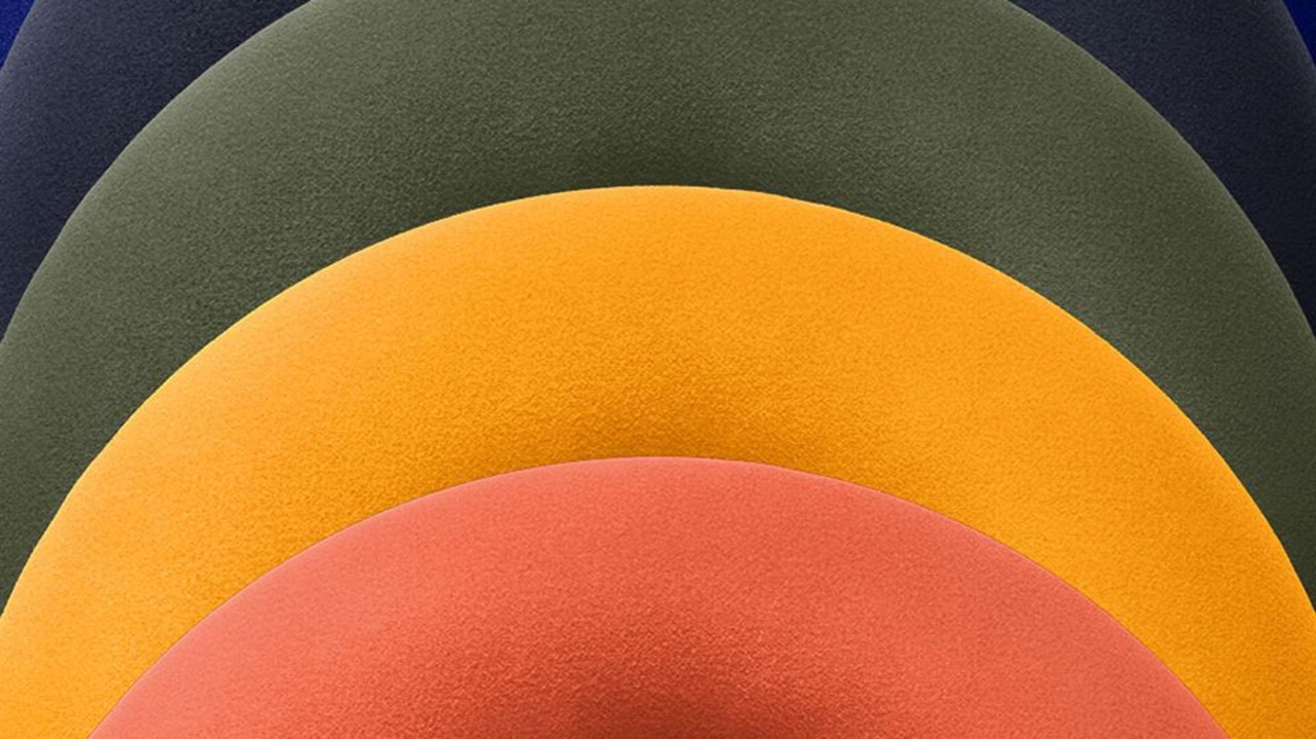 A stack of Dyson OnTrac ear cushions in various colours.