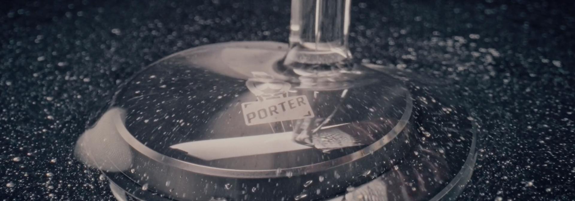 Resin is poured over the custom laser etching of the PORTER logo on a Dyson OnTrac outer cap.