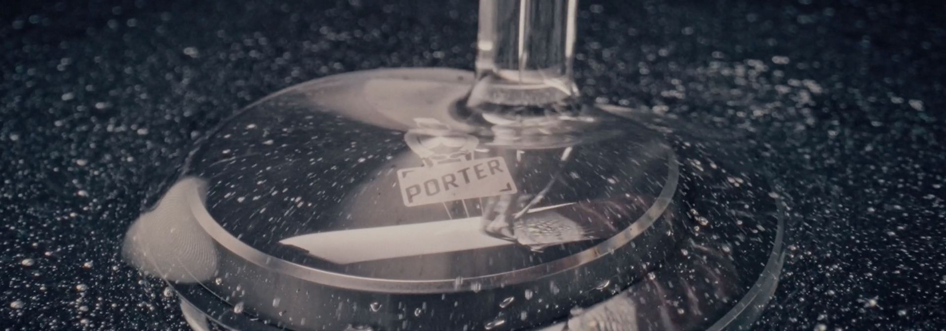 Resin is poured over the custom laser etching of the PORTER logo on a Dyson OnTrac outer cap.